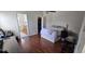 Cozy bedroom with wood floors, closet and attached bathroom at 14845 Huntley Dr, Orlando, FL 32828