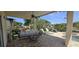 Covered patio with comfortable seating and an outdoor fan, perfect for entertaining at 14845 Huntley Dr, Orlando, FL 32828