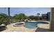 Beautiful backyard with a private pool, spa, and lush landscaping at 14845 Huntley Dr, Orlando, FL 32828