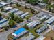 Aerial view showcasing the community's layout, manicured lawns, and convenient road access at 3043 Sego Ln, Lakeland, FL 33801