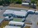 Aerial view of community clubhouse, shuffleboard courts, and surrounding homes at 3043 Sego Ln, Lakeland, FL 33801