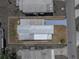 This aerial shot highlights the metal roof and painted driveway at 3043 Sego Ln, Lakeland, FL 33801