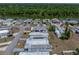 Aerial view of community featuring cozy homes, and well-maintained streets near the river at 3043 Sego Ln, Lakeland, FL 33801