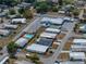 Aerial view of community featuring cozy homes, mature trees, pool and well-maintained streets at 3043 Sego Ln, Lakeland, FL 33801