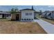 Charming single-story home featuring a well-manicured lawn, and a private carport at 3043 Sego Ln, Lakeland, FL 33801