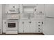Bright kitchen with white cabinets, modern appliances, and plenty of counter space at 3043 Sego Ln, Lakeland, FL 33801