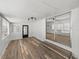 Bright sun room featuring white walls, vinyl flooring, and sliding mirror doors at 3043 Sego Ln, Lakeland, FL 33801