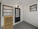 Sun room featuring neutral colors, black door and vinyl flooring at 3043 Sego Ln, Lakeland, FL 33801