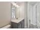 Bathroom boasts a single sink vanity with modern lighting and fixtures at 3102 Voyager Ave, St Cloud, FL 34771