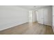 Bright bedroom featuring wood-look floors and access to a bathroom at 3102 Voyager Ave, St Cloud, FL 34771
