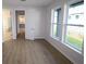 Comfortable bedroom with wood flooring, large windows, and plenty of closet space at 3102 Voyager Ave, St Cloud, FL 34771