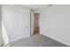 Bedroom with carpet, neutral walls, and an open doorway to the hall at 3102 Voyager Ave, St Cloud, FL 34771