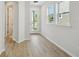 Inviting entryway with light hardwood flooring, showcasing the home's bright and airy ambiance at 3102 Voyager Ave, St Cloud, FL 34771