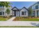 Charming single-story home with a modern facade, complemented by a well-maintained front yard and walkway at 3102 Voyager Ave, St Cloud, FL 34771