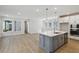 Modern kitchen with a large island, stainless steel appliances, and an open layout perfect for entertaining at 3102 Voyager Ave, St Cloud, FL 34771