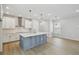 Bright kitchen featuring a large island, modern cabinetry, and stainless steel appliances, creating a culinary haven at 3102 Voyager Ave, St Cloud, FL 34771
