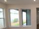 Bright living room featuring two windows, recessed lighting and neutral wall colors at 3102 Voyager Ave, St Cloud, FL 34771
