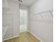 Large walk-in closet includes white wire shelving and an entrance to the ensuite bathroom at 3102 Voyager Ave, St Cloud, FL 34771
