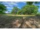 Large, fenced-in backyard featuring mature shade trees at 7795 Sw 72Nd Ct, Ocala, FL 34476