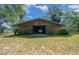 Exterior of barn with open doorway, and wood construction at 7795 Sw 72Nd Ct, Ocala, FL 34476