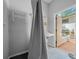 Simple bathroom with an open door to the outside at 7795 Sw 72Nd Ct, Ocala, FL 34476
