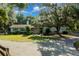 Charming home with green trees and a circular driveway at 7795 Sw 72Nd Ct, Ocala, FL 34476
