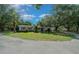 Beautiful home featuring mature trees and well-maintained front yard at 7795 Sw 72Nd Ct, Ocala, FL 34476