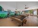 Recreational room with a pool table and vibrant murals providing a fun and engaging entertainment area for residents and guests at 7795 Sw 72Nd Ct, Ocala, FL 34476