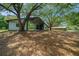 View of the large covered garage area with mature trees at 7795 Sw 72Nd Ct, Ocala, FL 34476