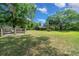 Lush grassy land surrounded by mature trees offers an open and scenic setting with fencing at 7795 Sw 72Nd Ct, Ocala, FL 34476