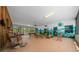 Vast, versatile living space with ample seating and tropical-themed murals at 7795 Sw 72Nd Ct, Ocala, FL 34476