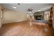 Bright living room featuring gleaming wood floors and a striking stone fireplace at 7795 Sw 72Nd Ct, Ocala, FL 34476