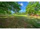 Picturesque pasture with mature trees, enhancing the property's rural charm and offering a serene and natural setting at 7795 Sw 72Nd Ct, Ocala, FL 34476