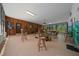 Large recreation room with chairs, offering flexible space for a variety of activities and social gatherings at 7795 Sw 72Nd Ct, Ocala, FL 34476