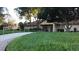 Exterior of the Nature's Club House featuring a manicured lawn and a golf cart at 7040 Tamarind Dr, Lake Wales, FL 33898