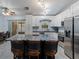 Kitchen with stainless steel appliances, granite countertops, and stylish island at 7040 Tamarind Dr, Lake Wales, FL 33898