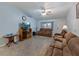 Cozy living room area with comfortable seating and entertainment center at 7040 Tamarind Dr, Lake Wales, FL 33898
