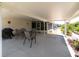 Spacious patio offers a beautiful outdoor living space for entertaining guests and enjoying peaceful moments at 7040 Tamarind Dr, Lake Wales, FL 33898