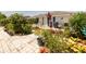Lush landscaped yard featuring colorful plantings and mature trees, enhancing the property's curb appeal and tranquility at 7040 Tamarind Dr, Lake Wales, FL 33898