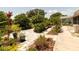 Expansive yard adorned with lush landscaping, paved walkways, and diverse plantings, perfect for outdoor enjoyment at 7040 Tamarind Dr, Lake Wales, FL 33898