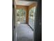 The balcony is screened in and has a view of the green trees and outdoor space at 12020 Villanova Dr # 107, Orlando, FL 32837