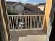 Balcony view of neighboring buildings and parking area from the unit's private outdoor space at 12020 Villanova Dr # 107, Orlando, FL 32837