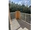 View of a private balcony with white railing, providing an outdoor space for relaxation and enjoyment at 12020 Villanova Dr # 107, Orlando, FL 32837