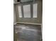 Bedroom featuring wood floors, neutral paint and baseboards, ceiling fan and two large windows at 12020 Villanova Dr # 107, Orlando, FL 32837