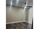 Bedroom with hardwood flooring, neutral paint, ceiling fan, and natural light from a sliding glass door at 12020 Villanova Dr # 107, Orlando, FL 32837