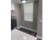 The kitchen nook has waterproof flooring, a window, and a view of a stainless steel refrigerator at 12020 Villanova Dr # 107, Orlando, FL 32837