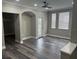Bright living room featuring hardwood floors, neutral paint, ceiling fan, and lots of natural light at 12020 Villanova Dr # 107, Orlando, FL 32837