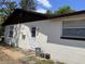 Exterior view showing the back entrance door with landscaping at 1230 Jasmine Rd, Apopka, FL 32703