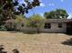 View of the backyard showing trees providing shade and privacy at 1230 Jasmine Rd, Apopka, FL 32703