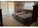 Bright bedroom with two beds, natural light, and classic decor at 1230 Jasmine Rd, Apopka, FL 32703